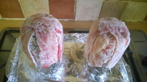 Bacon draped over cans