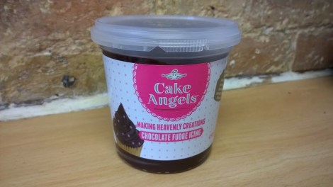 Tub of chocolate fudge icing